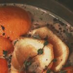 orange peels and herbs in simmering stovetop potpourri